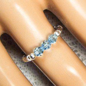 Cynthia Lynn "CELEBRATE" Blue Swarovski Crystal Dec. Birthstone Stretch Ring